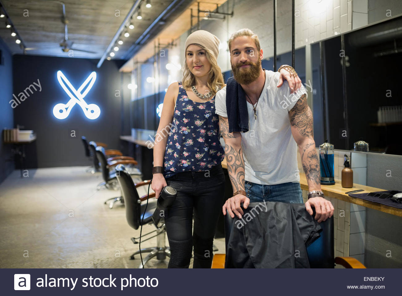 Portrait of young confident hairstylist standing in modern hair salon Stock  Photo - Alamy