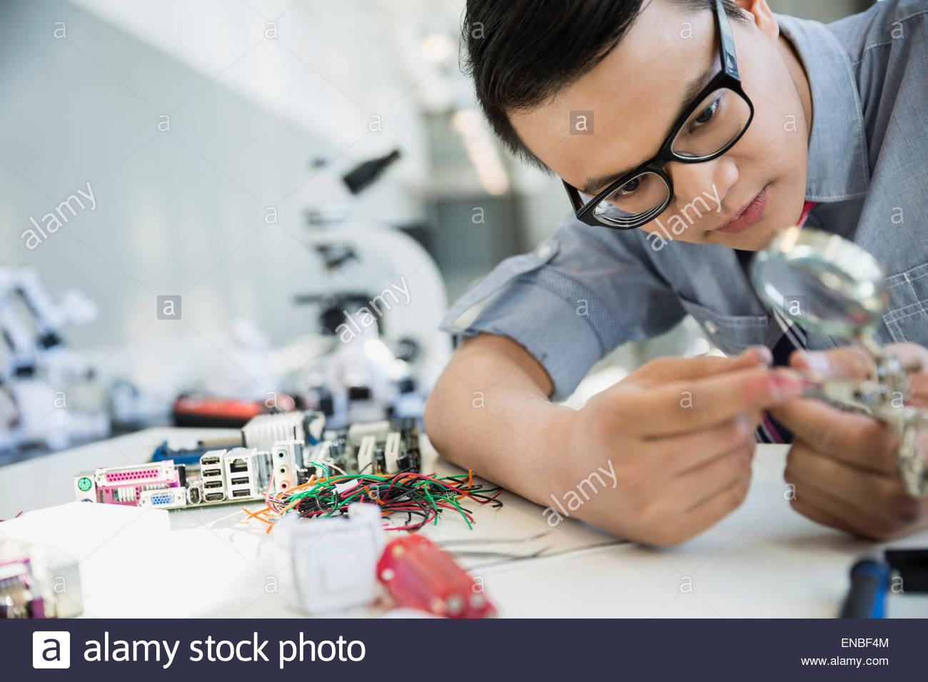Engineer examining and assembling technology Stock Photo