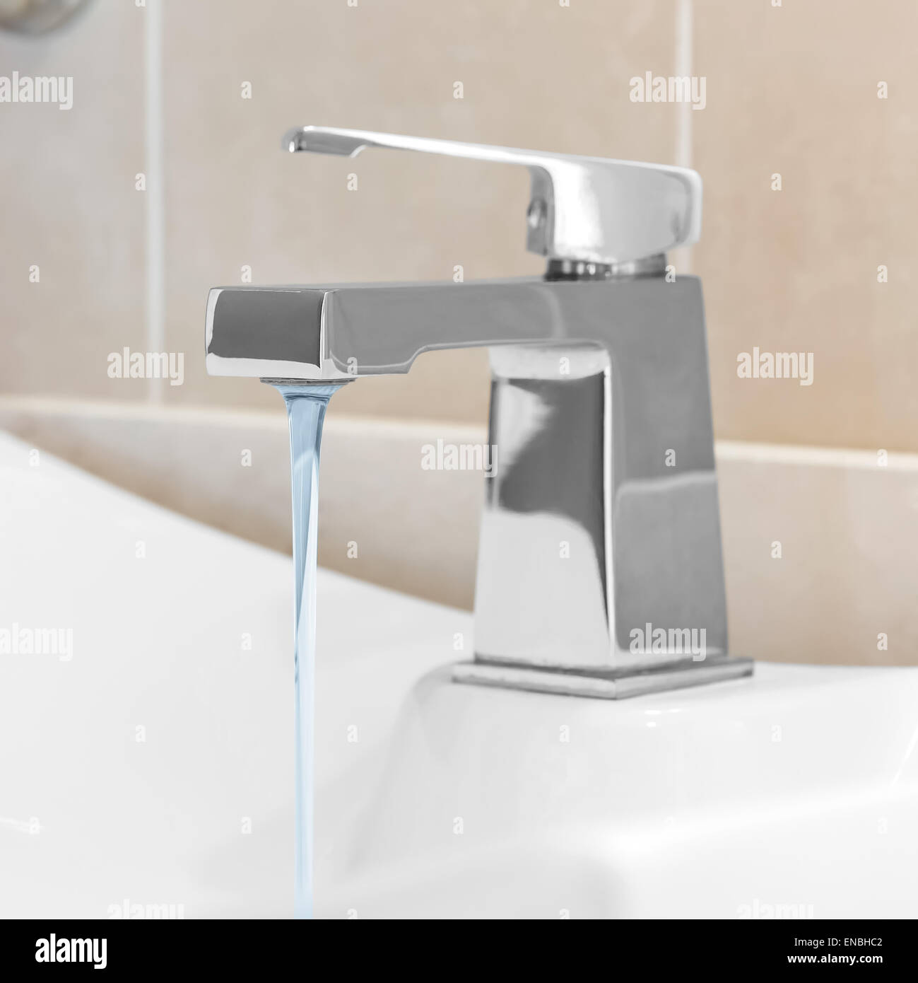 Faucet in bathroom, water is running Stock Photo Alamy