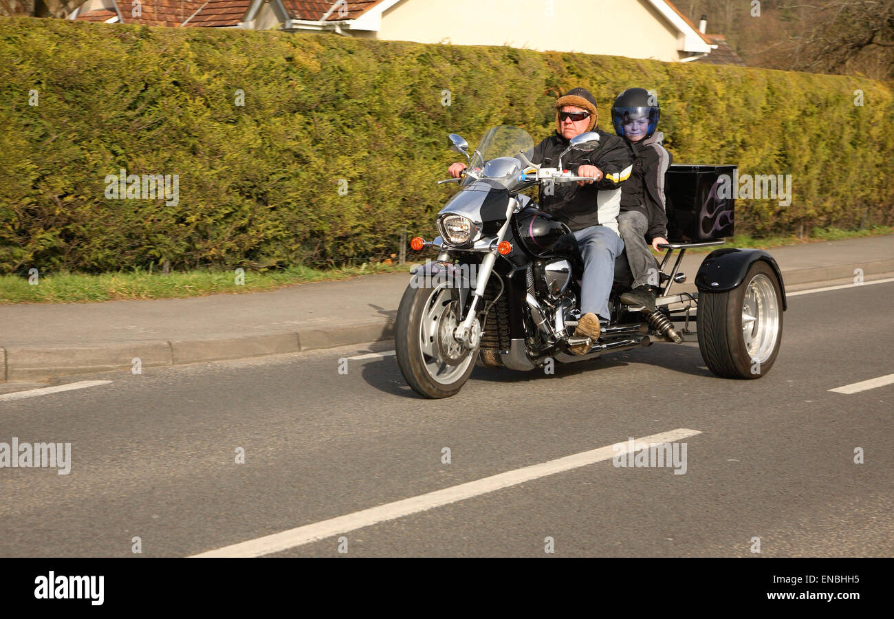 Motor trike with rider and passenger Stock Photo Alamy