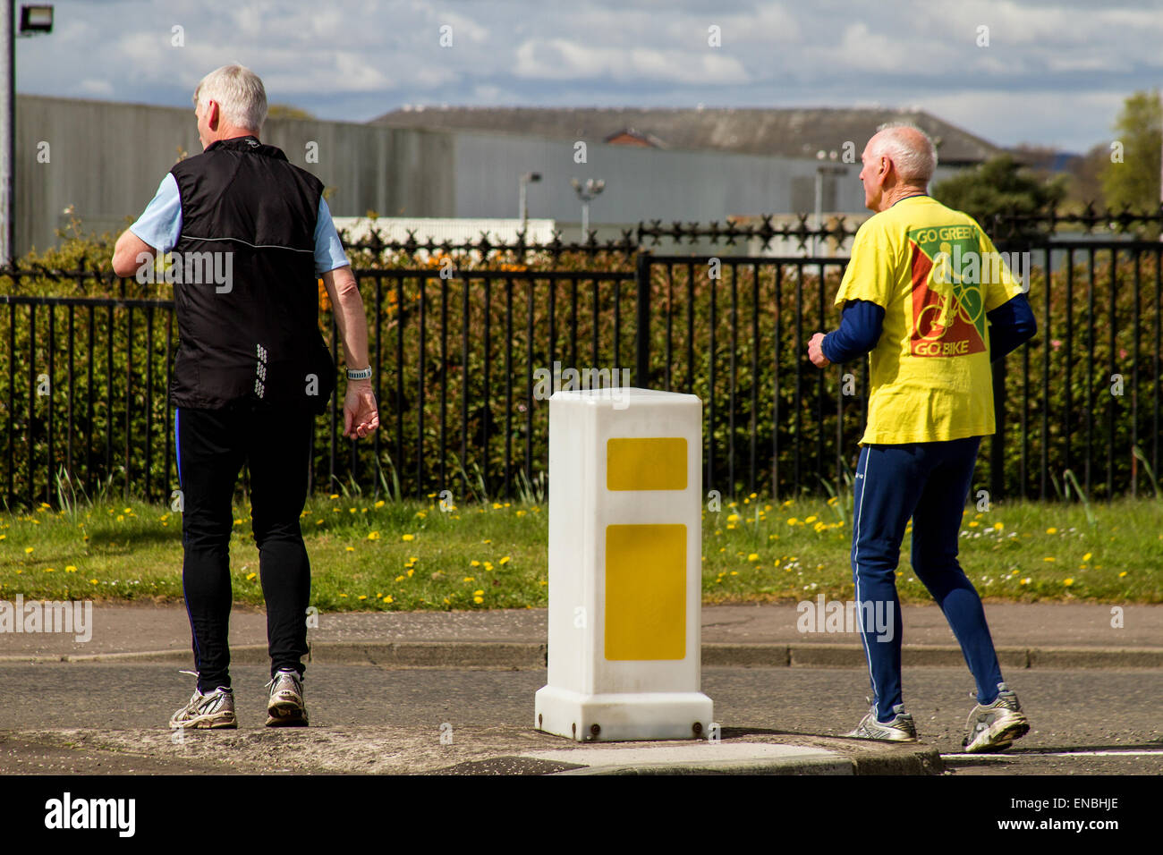 Old age pensioners keeping fit jogging across MacAlpine Road at