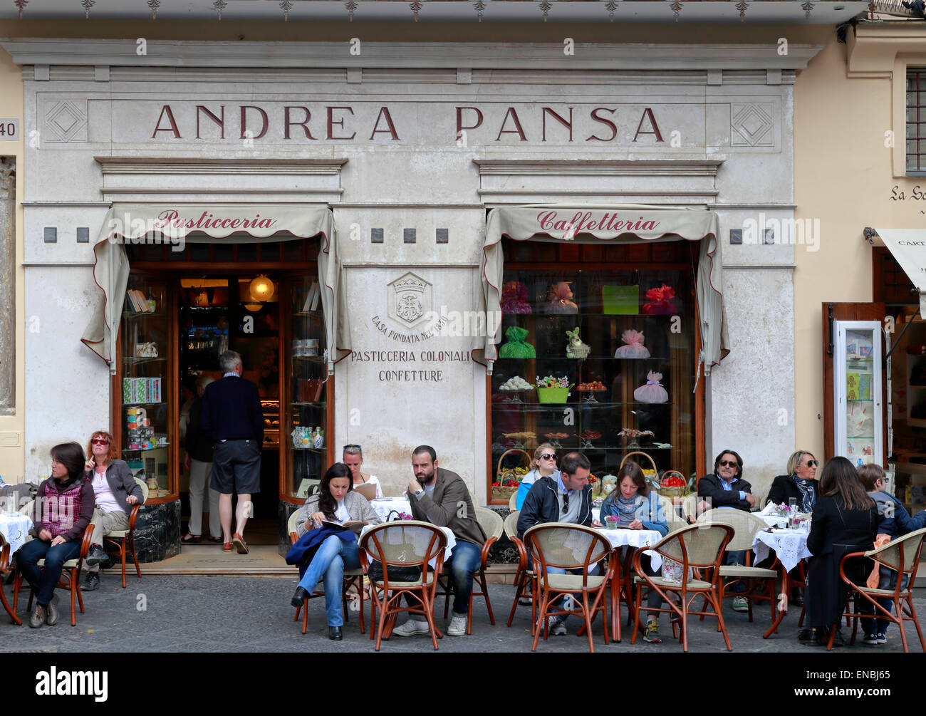 Tourists sat outside Pasticceria Andrea Pansa in Piazza Duomo, Amalfi, Italy. Stock Photo