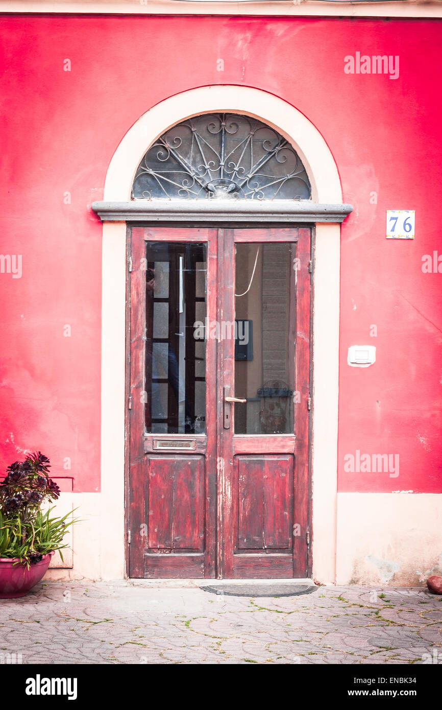 glass door closed with red wall Stock Photo - Alamy