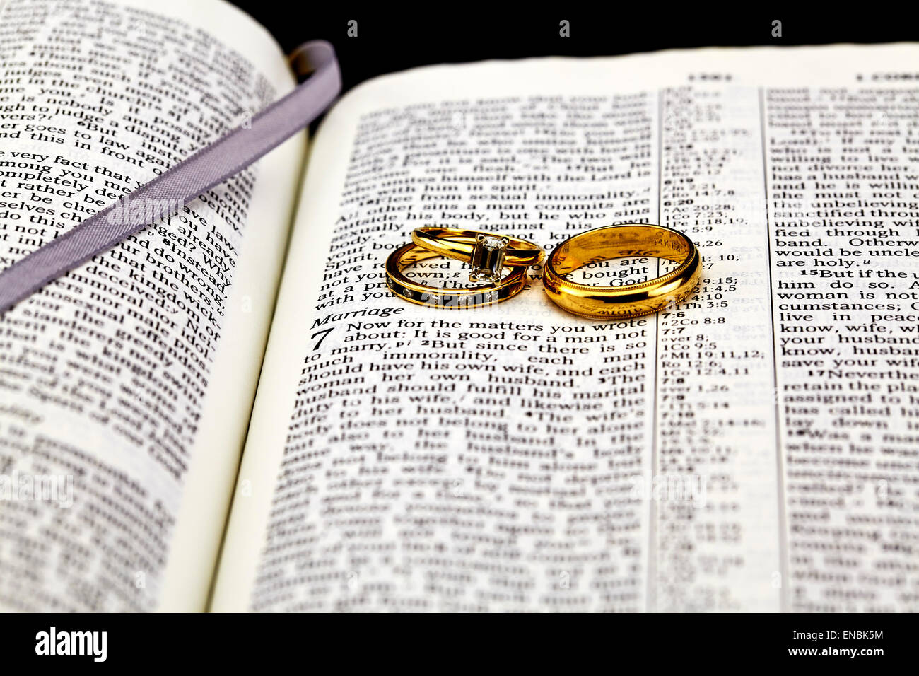 Bible selective focused on marriage and gold and diamond wedding ring set Stock Photo