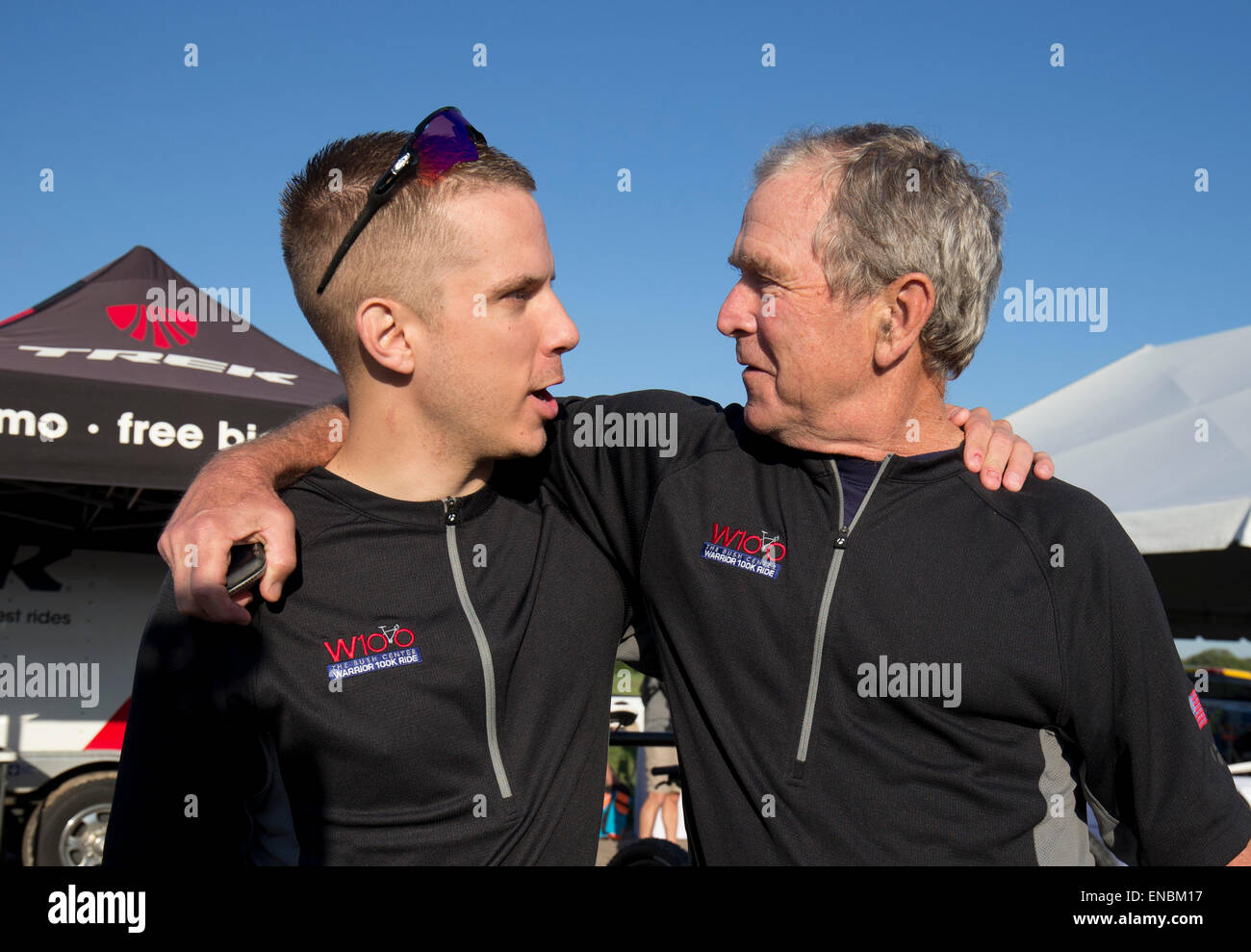 Former U.S. President George W. Bush, r, greets rider at the Bush Institute Warrior 100K bike ride at his Texas ranch Stock Photo