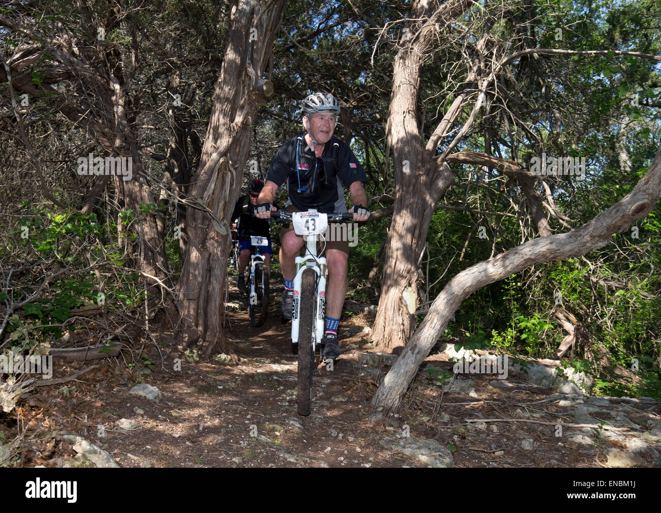 Former U.S. President George W. Bush on trail at Bush Institute Military Service Initiative W100K bike ride at his Texas ranch Stock Photo