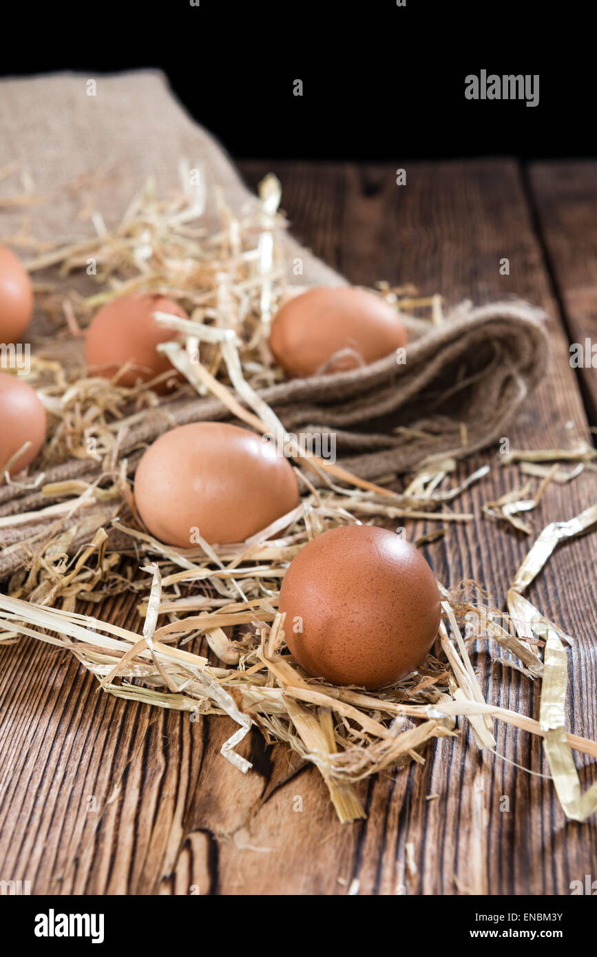 Some fresh Eggs (close-up shot) on dark wooden background Stock Photo ...