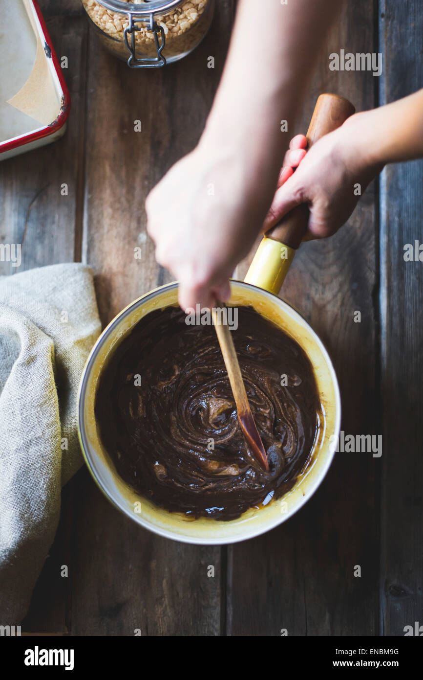 Chocolate crisp rice treats being prepared in a saucepan Stock Photo