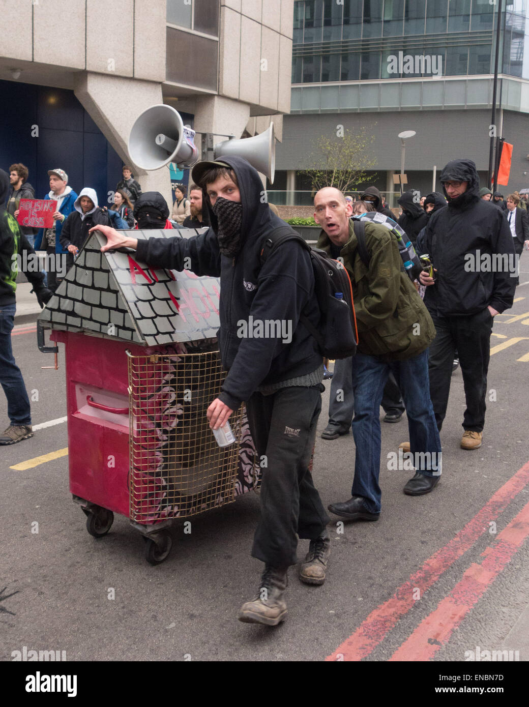 London, 1st May 2015 Anti-capitalist protesters push their mobile sound system through central London from Aldgate East tube station to Frith Street in Soho as part of a May day anti-gentrification protest. Credit:  Patricia Phillips/Alamy Live News Stock Photo