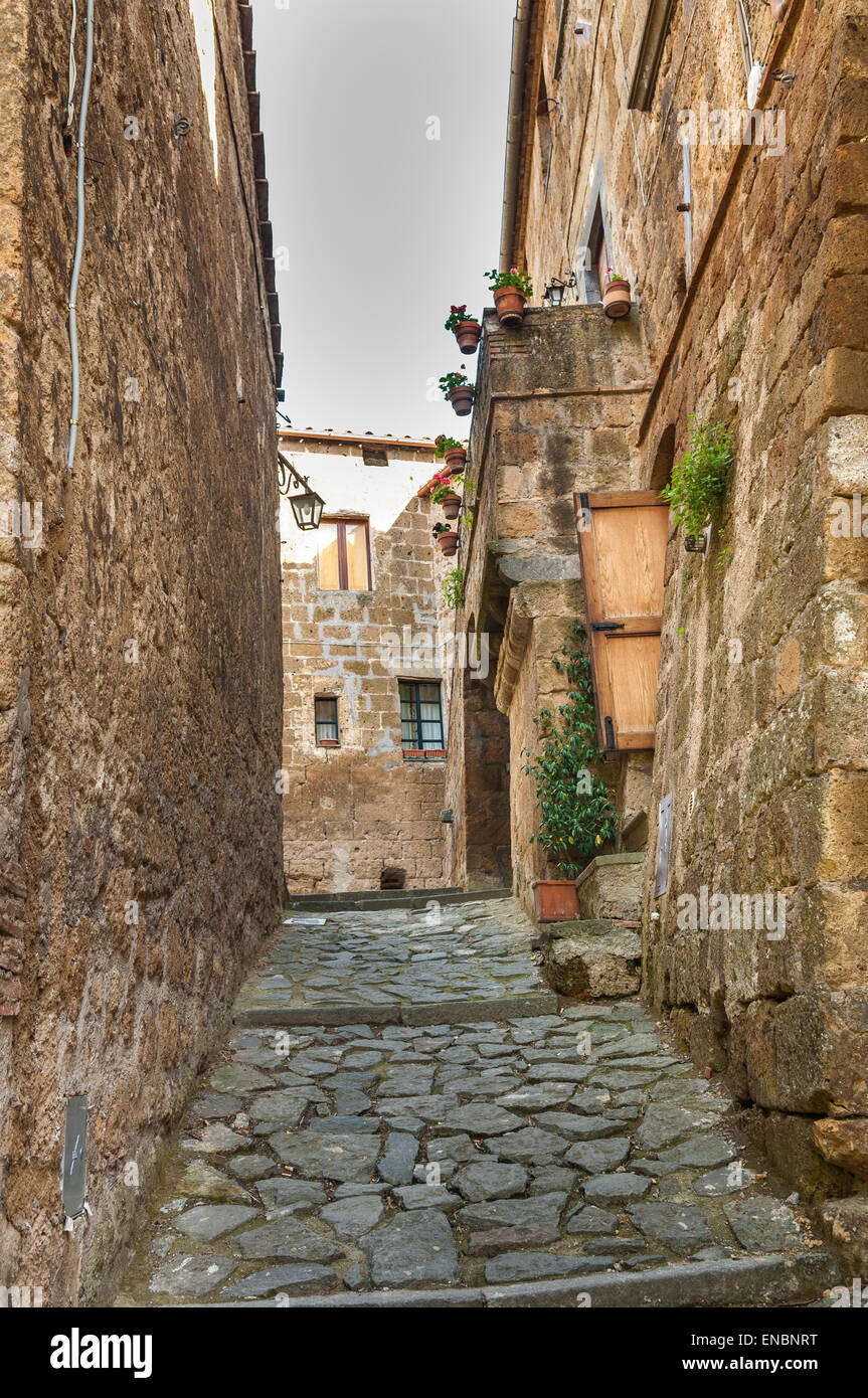 Narrow cobblestone passageway in Civita di Bagnoregio, Italy Stock Photo