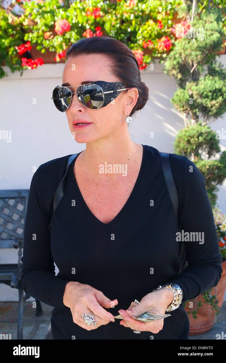 Kyle Richards wearing Chanel lambskin aviator sunglasses and matching  backpack while lunching at Il Pastaio restaurant in Beverly Hills  Featuring: Kyle Richards Where: Los Angeles, California, United States  When: 27 Oct 2014