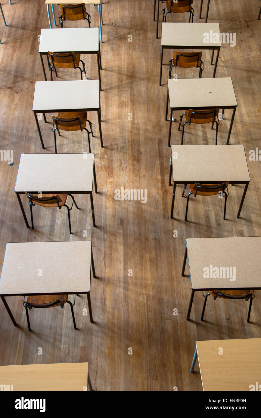Rows Of Desk And Chairs Waiting For Exam At Highschool Stock Photo
