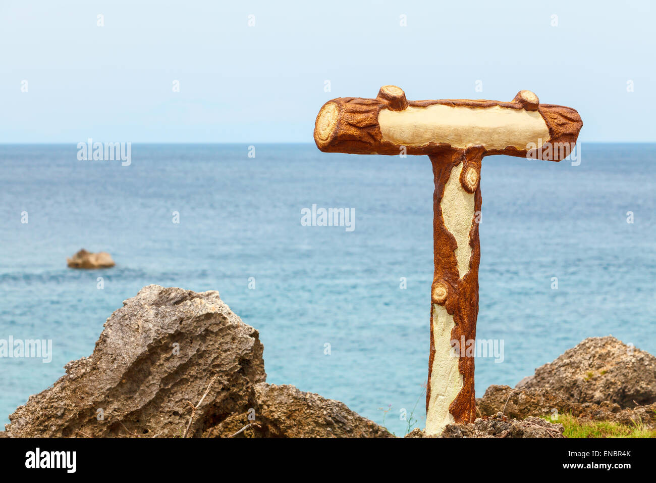 Wood plate table on stone island on tropical sea Stock Photo