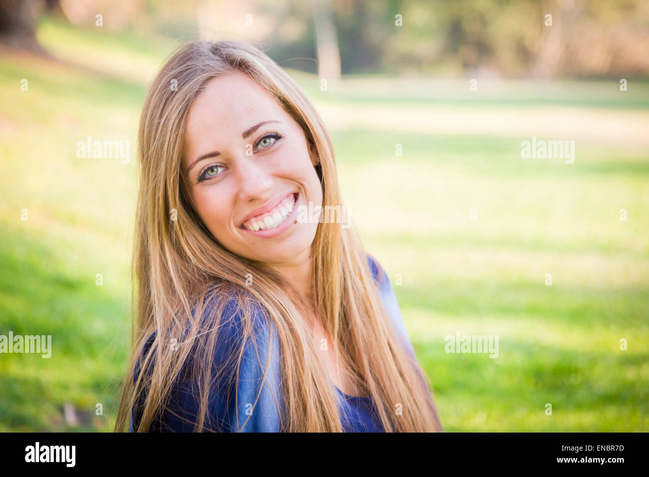 Portrait of a Beautiful Young Woman Outdoors at the Park Stock Photo ...