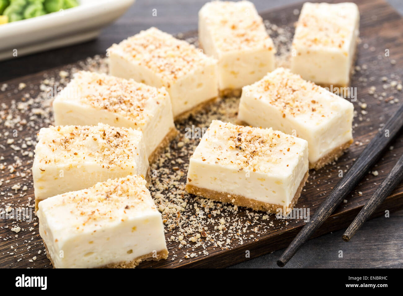 Sweet cheesecake with almond. Served in sushi restaurant Stock Photo