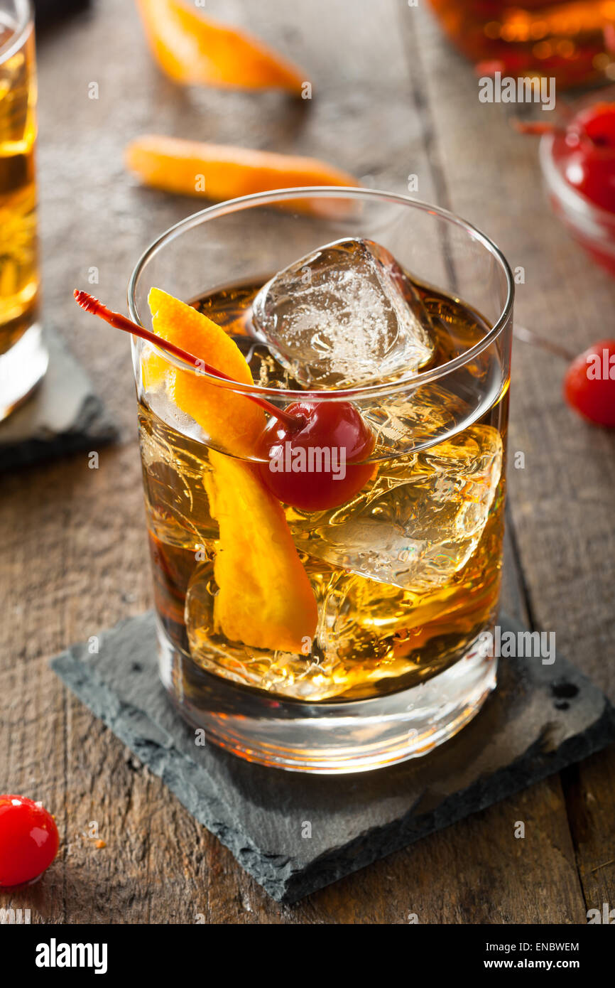 Homemade Old Fashioned Cocktail with Cherries and Orange Peel Stock