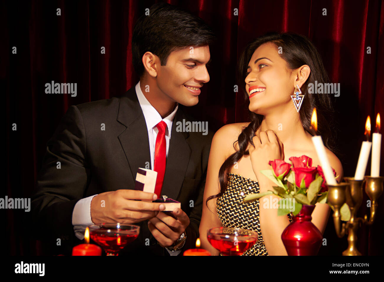 2 indian business Couple Hotel Ring Proposing Stock Photo