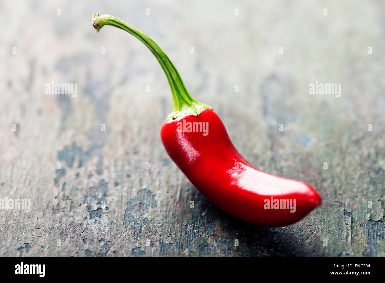 Red Hot Chili Peppers over wooden background Stock Photo - Alamy
