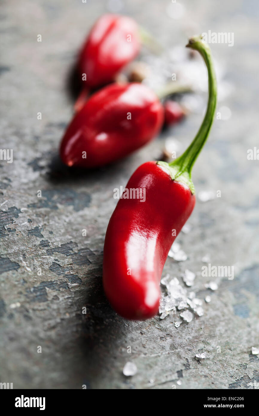 Red Hot Chili Peppers over wooden background Stock Photo - Alamy
