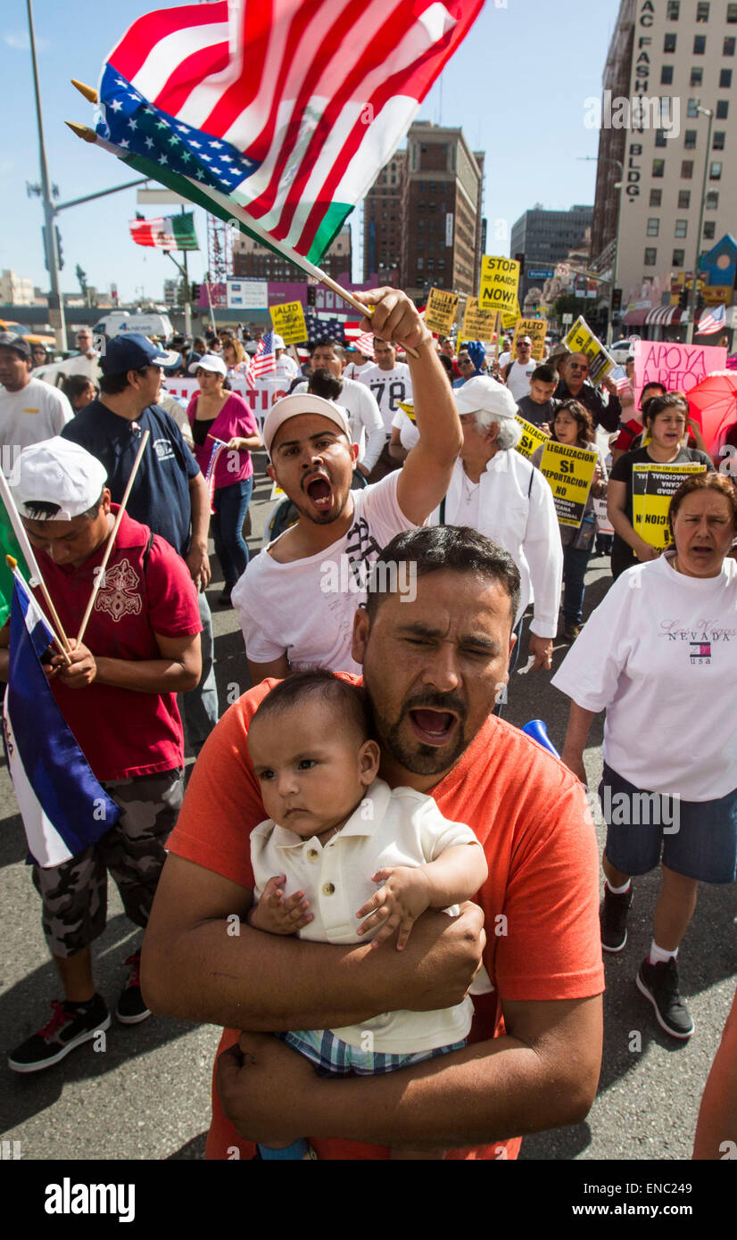(150502)-- LOS ANGELES, May 2, 2015(Xinhua)-- Protesters shouting slogans march toward downtown Los Angeles as thousands of people participating in the annual May Day march downtown Los Angeles May 1, 2015. Labor organizations and immigration groups held the annual celebration to push for higher wages, immigration reform and justice for minorities. (Xinhua/Zhao Hanrong)(azp) Stock Photo