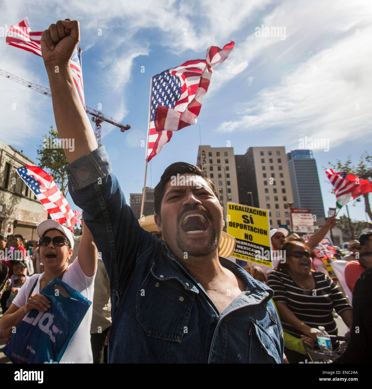 (150502)-- LOS ANGELES, May 2, 2015(Xinhua)-- Protesters shouting slogans march toward downtown Los Angeles as thousands of people participating in the annual May Day march downtown Los Angeles May 1, 2015. Labor organizations and immigration groups held the annual celebration to push for higher wages, immigration reform and justice for minorities. (Xinhua/Zhao Hanrong)(azp) Stock Photo