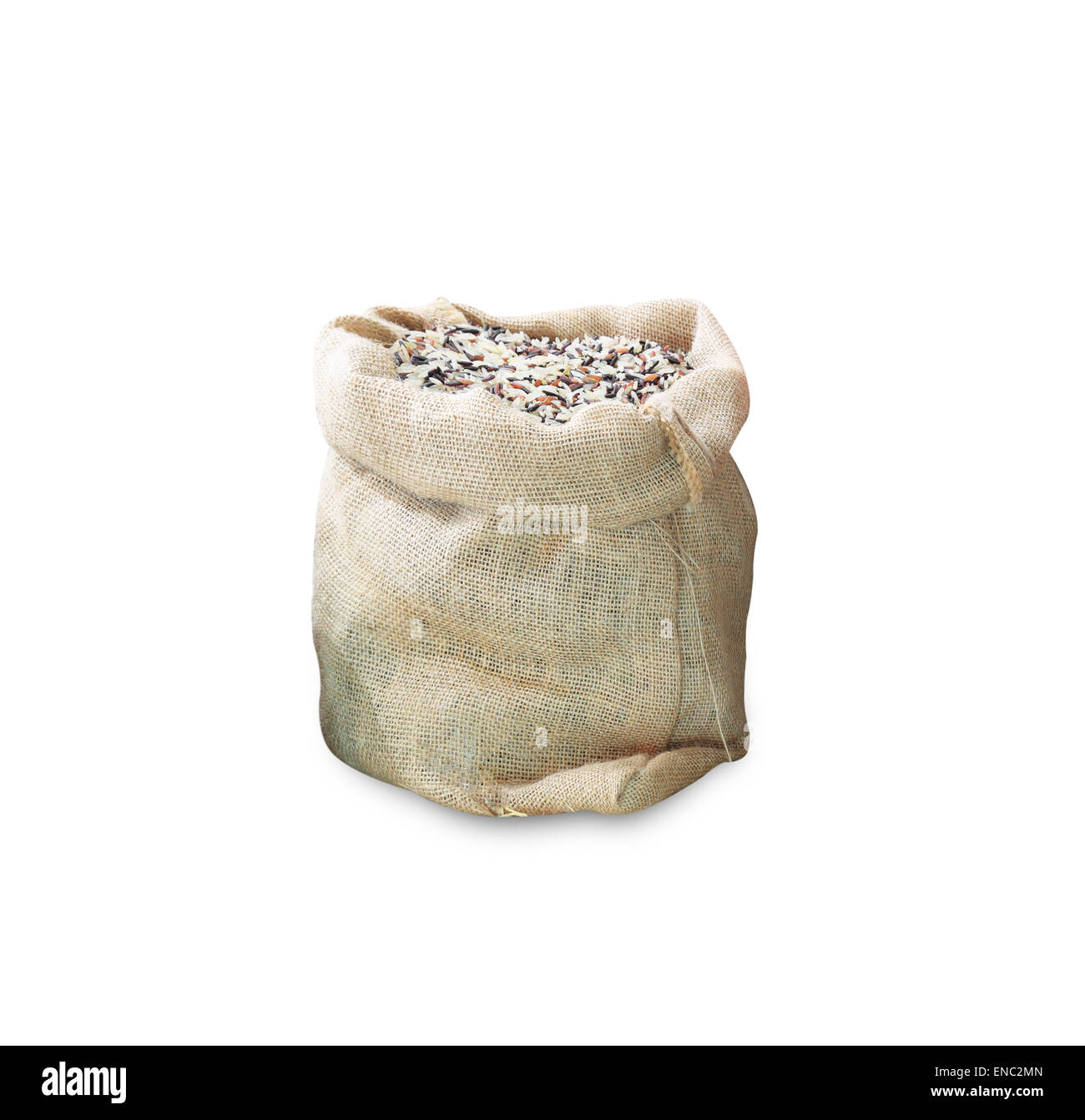 Raw long grain white rice grains in burlap bag Stock Photo