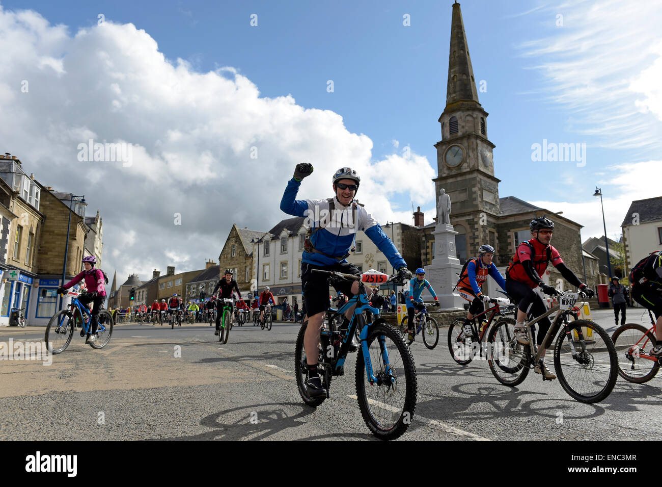 Selkirk, UK. 02.May.2015. MTB Festival, Merida Selkirk MTB Endurance Event starts in Selkirk, as part of the Merida MTB Marathon Series Competitors depart under convoy, passing thru Selkirk's Market Square. Over 650 entrants taking part in the 25km, 50km, 75km & 100km route challenges.  Credit:  Rob Gray/Alamy Live News Stock Photo