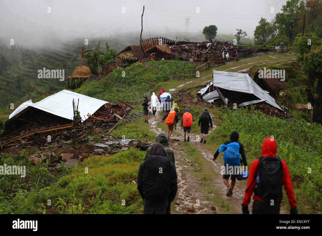 A group of tourists climb down from Barpak in the region of Saurpani in the Gorkha district, near the epicenter of the earthquake in Nepal, 28 April 2015. German tourist Jordane Schoenfelder and other foreigners have set up a medical and aid camp here for the locals - called base camp - which serves as a starting point for hikes in the surrounding mountains and for shipments of aid packages. Photo: JORDANE SCHOENFELDER/dpa Stock Photo