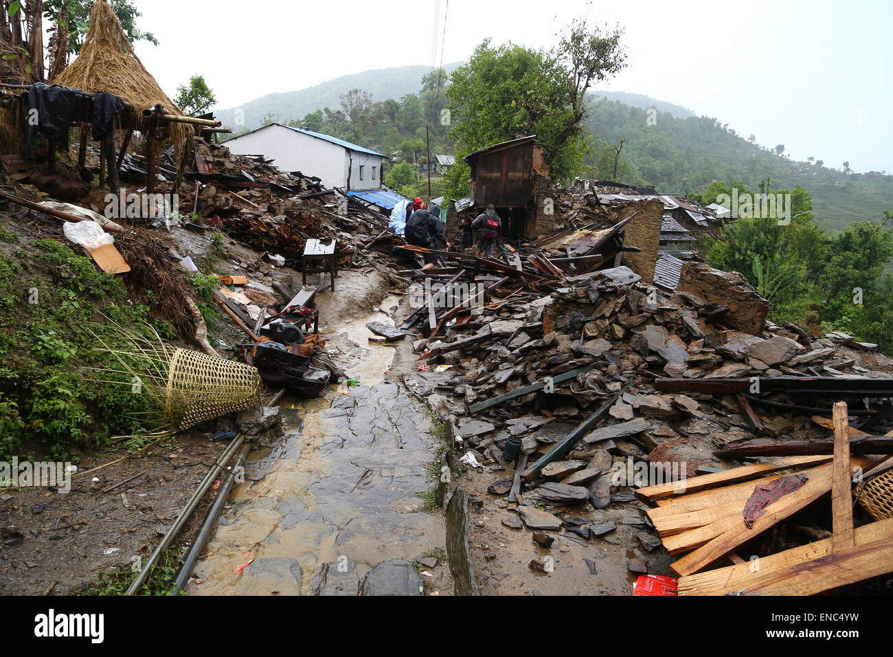Destroyed houses in the region of Saurpani in the Gorkha district, near the epicenter of the earthquake in Nepal, 28 April 2015. German tourist Jordane Schoenfelder and other foreigners have set up a medical and aid camp here for the locals - called base camp - which serves as a starting point for hikes in the surrounding mountains and for shipments of aid packages. Photo: JORDANE SCHOENFELDER/dpa Stock Photo