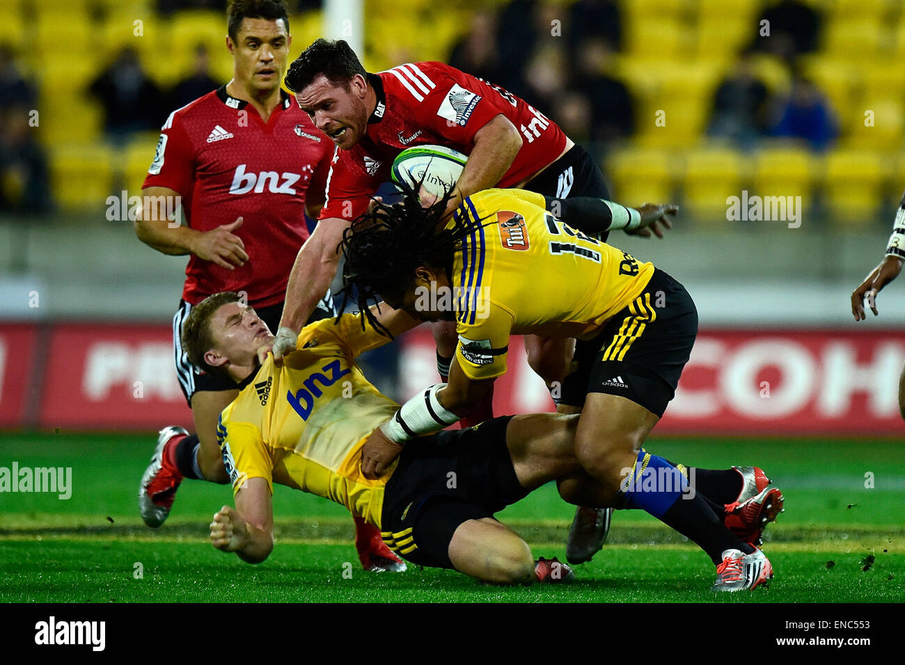 Wellington, New Zealand. 02nd May, 2015. Crusaders' Ryan Crotty (Top) is  tackled by Hurricanes' Ma'a Nonu (R and Beauden Barrett (L) during the  Super Rugby Hurricanes v Crusaders rugby match at the