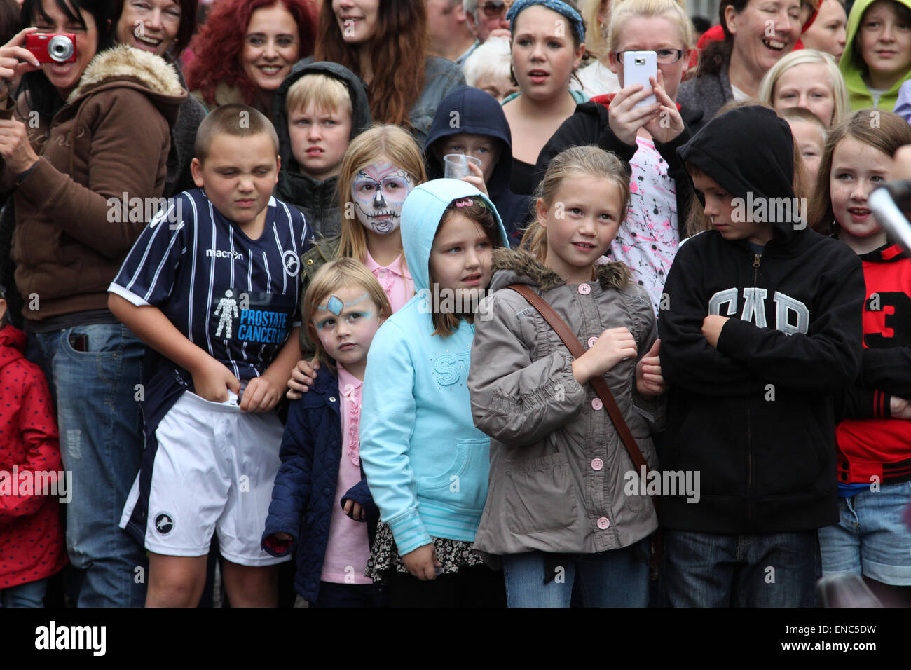 Children watching performance by Granny Turismo at the International ...