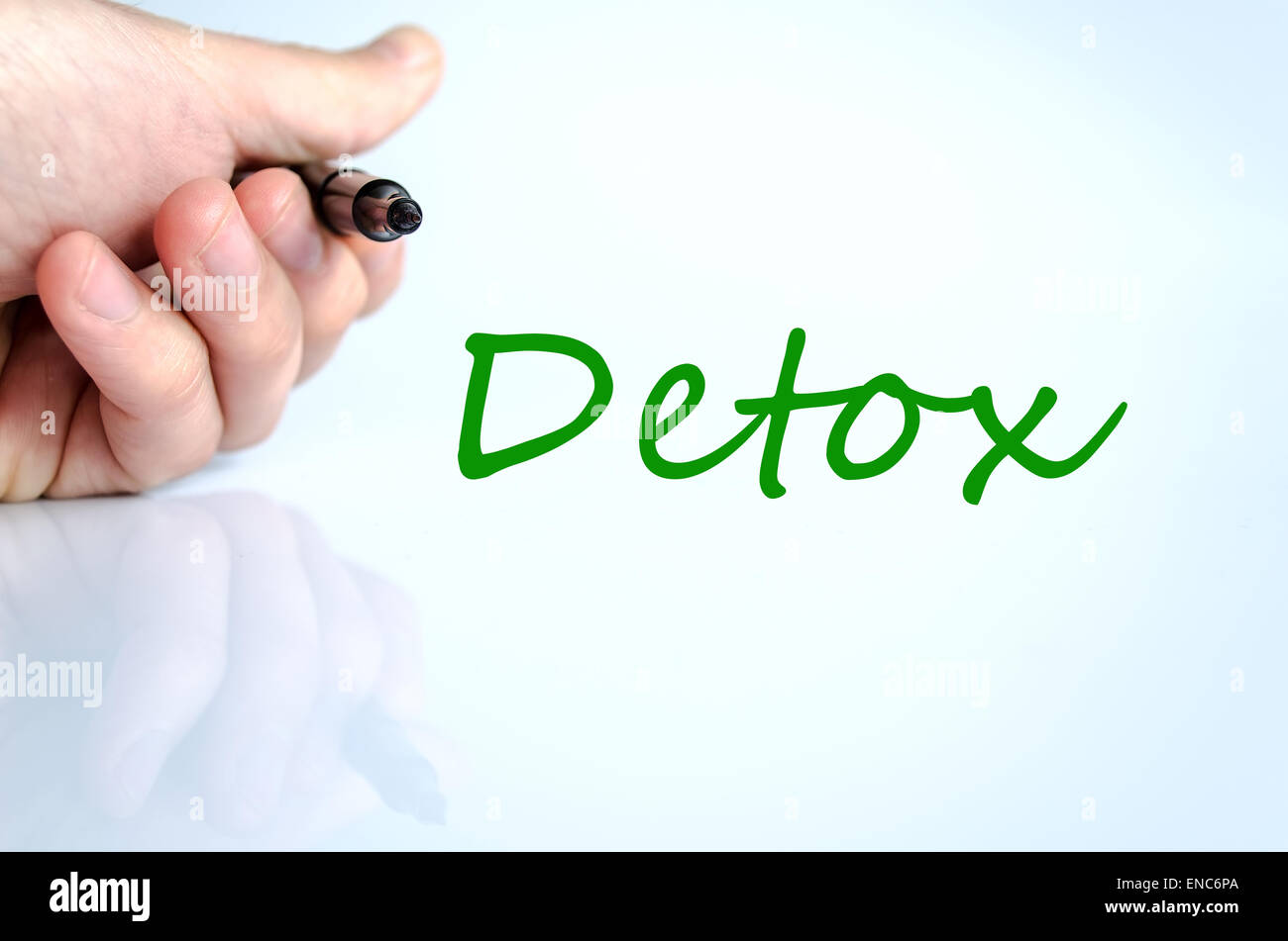 Pen in the hand isolated over white background detox concept Stock Photo