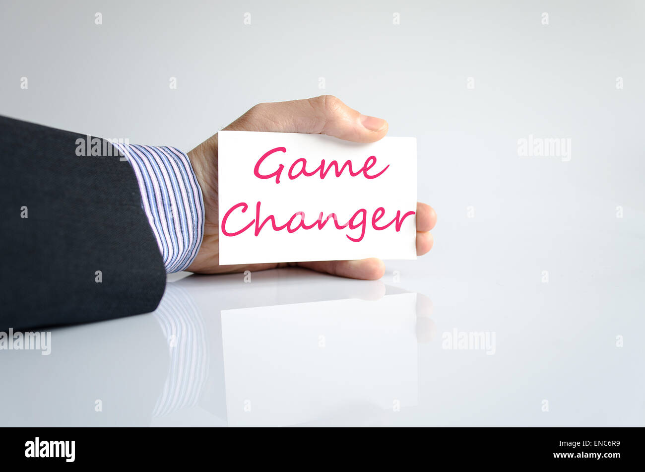 Bussines man hand writing game changer Stock Photo