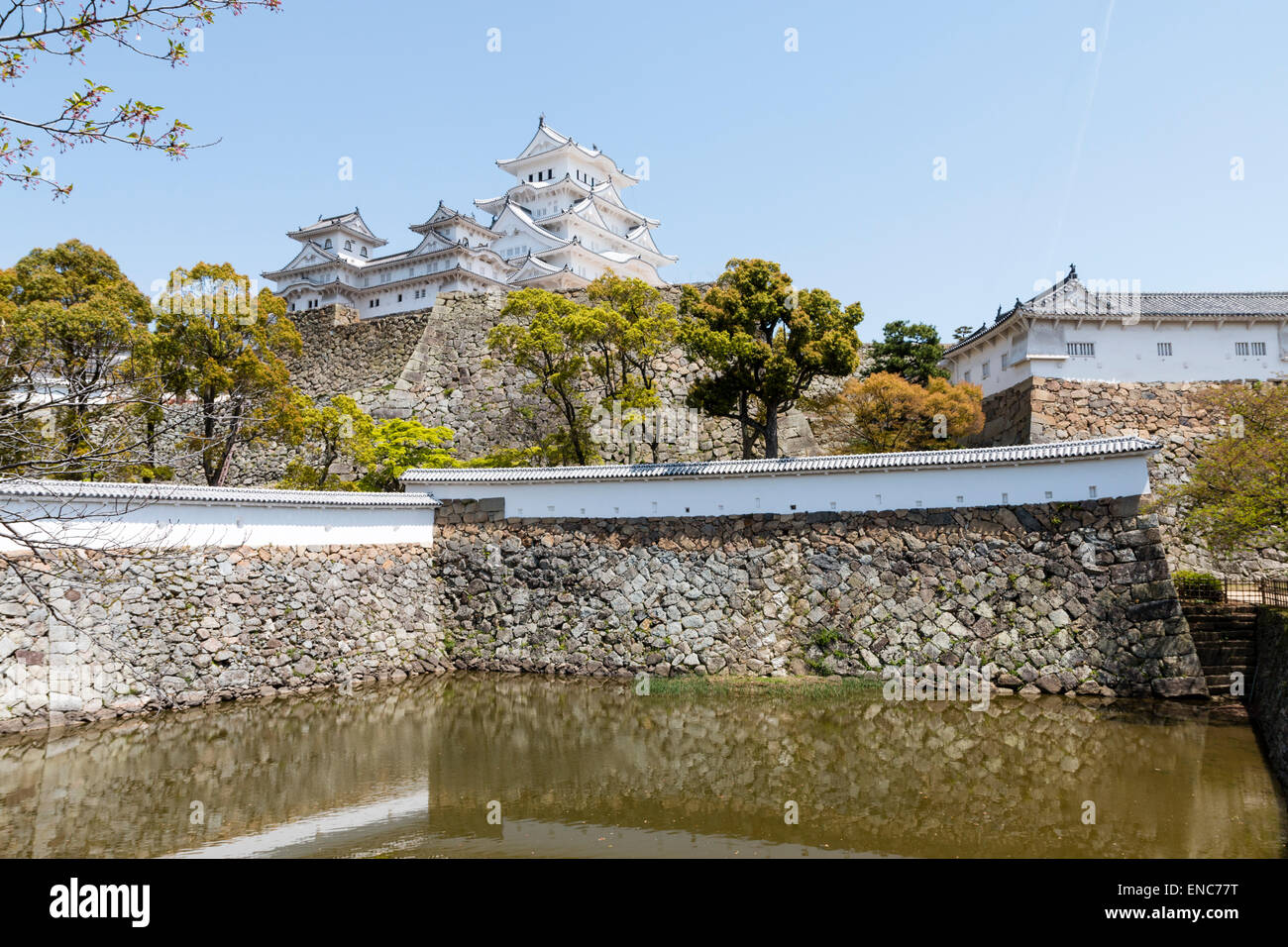 Himeji Castle, Japan. The Sangoku Bori, moat in foreground with Ishigaki tone walls  dobei walls, and the castle keep, the Daitenshu, in the background Stock Photo