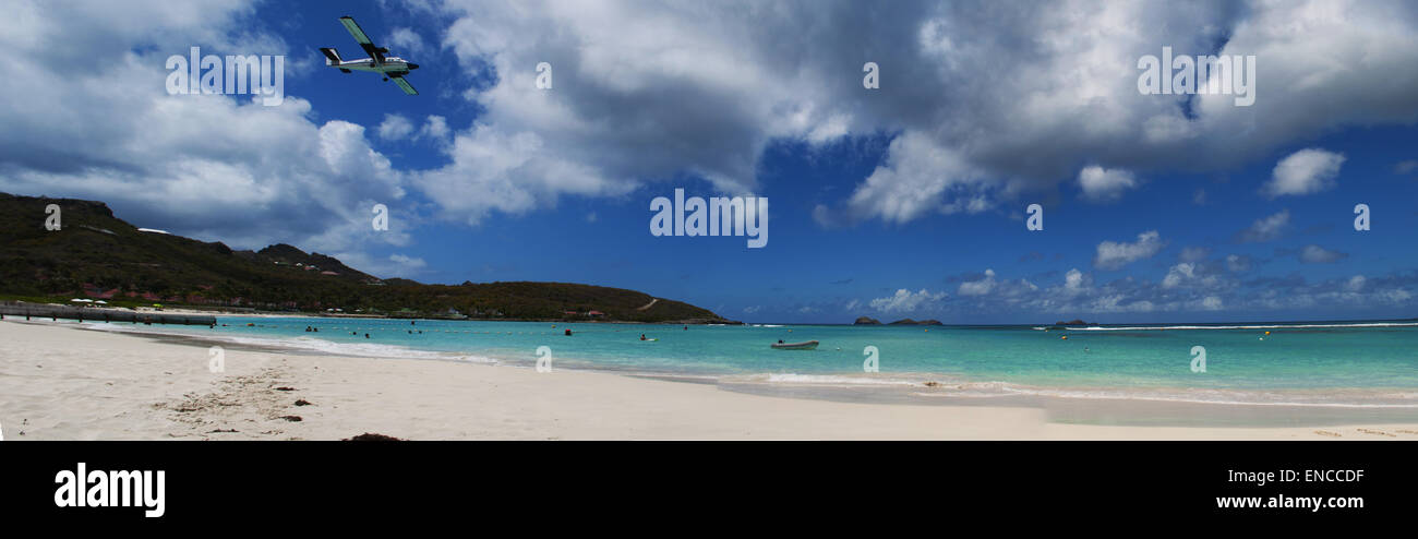 Saint Barthélemy, French West Indies, French Antilles, Caribbean: panoramic view of the the beach of Saint-Jean with an airplane taking off Stock Photo
