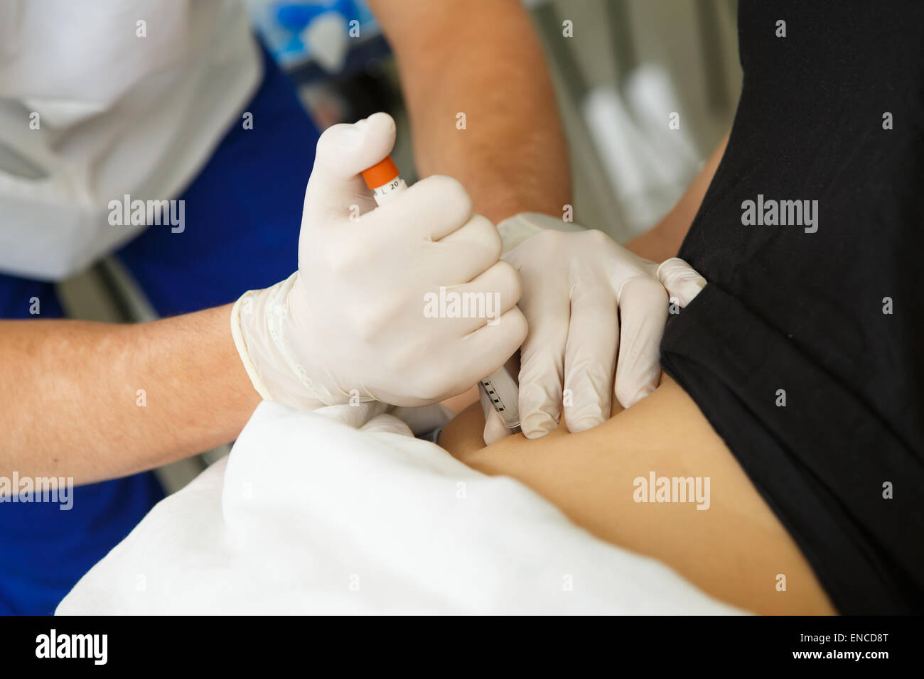 Stomach injection in the hospital Stock Photo - Alamy
