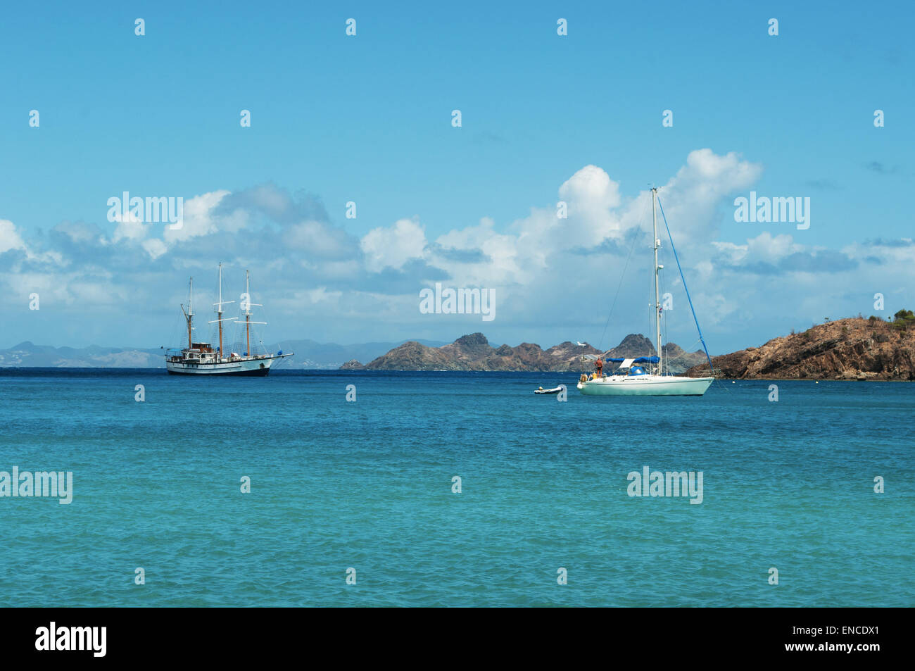 St Barth, St. Barths, Saint-Barthélemy, French West Indies, French Antilles: a sailboat and a sailing ship in the Caribbean Sea Stock Photo