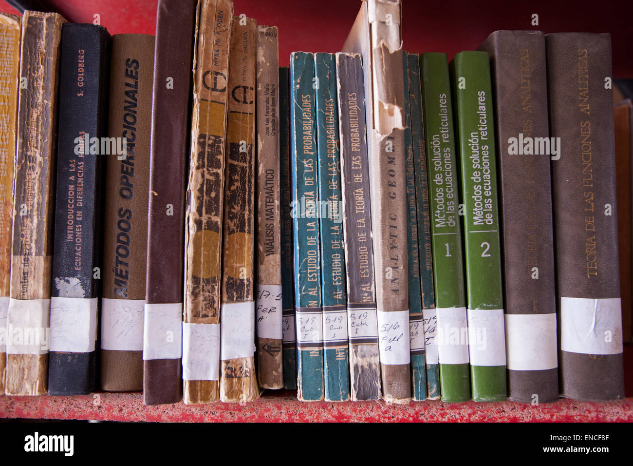 A row of books on a shelf in the library in Trinidad, Cuba. Stock Photo