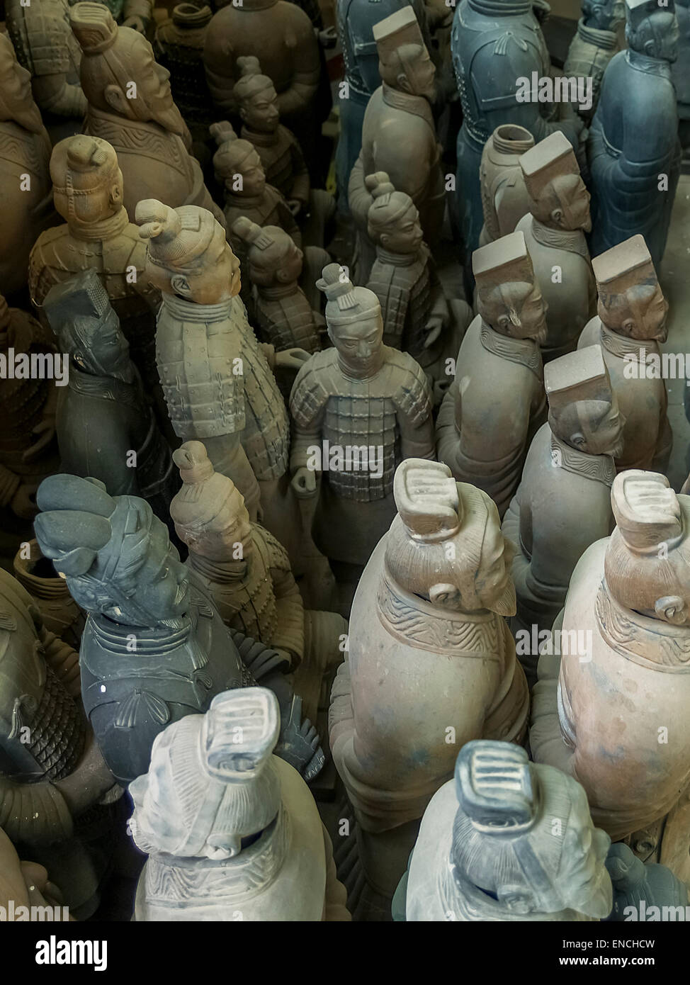 Terracotta Warrior Army statues of various sizes at a pottery factory