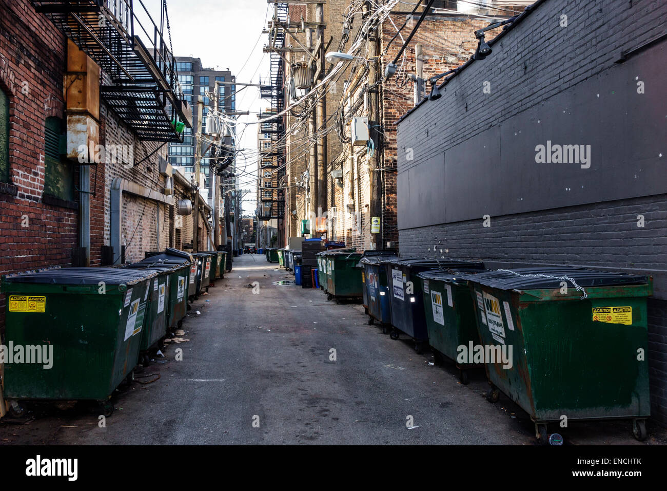 Chicago Illinois,Near North Side,neighborhood,urban street scene,alley,alleyway,back alley,service road,dumpster,trash bin,waste container,garbage,fir Stock Photo