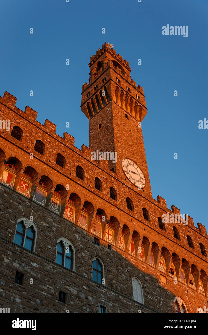 The Palazzo Vecchio tower in a lovely evening sun of Florence. Stock Photo