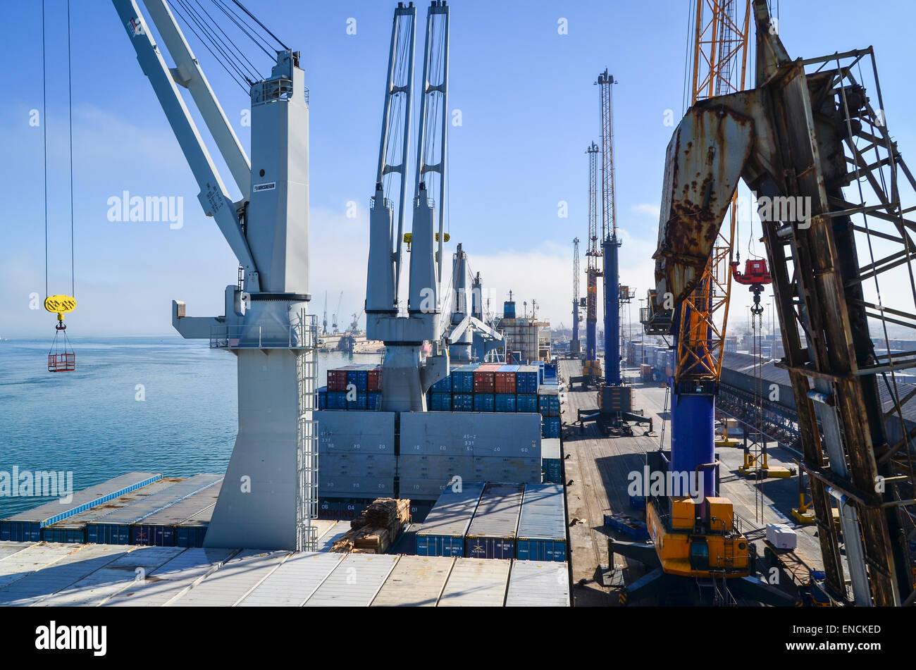 Cranes loading a cargo ship at the cargo terminal in the port of Walvis