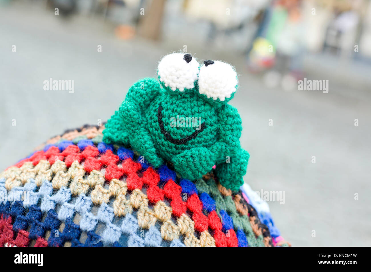 Hand crocheted figurines showing, Badajoz, Spain. Crochet frog Stock Photo