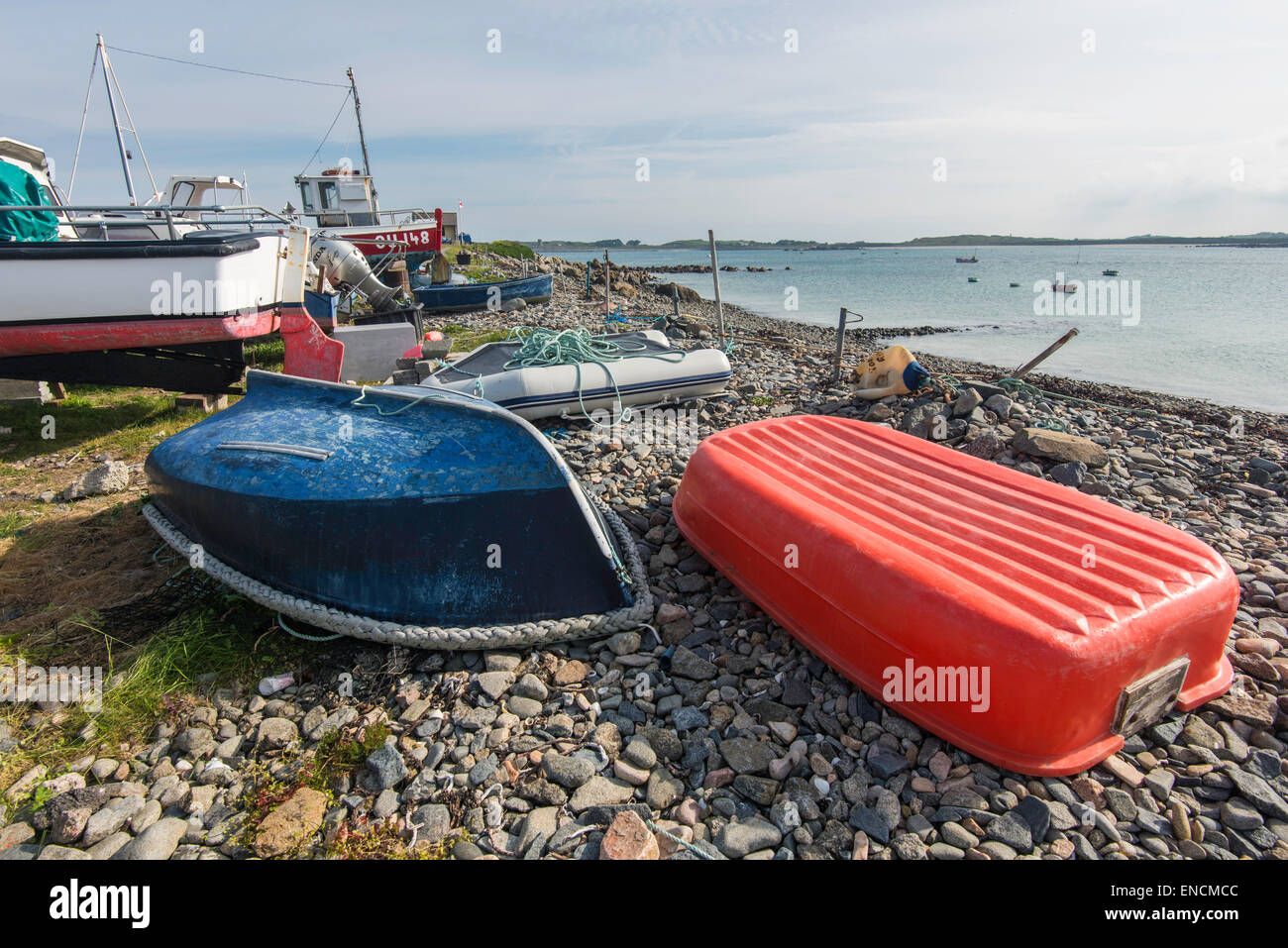 Fishing boats on shingle beach at Rousse, Grand Havre Bay, Guernsey, Channel Islands. Stock Photo