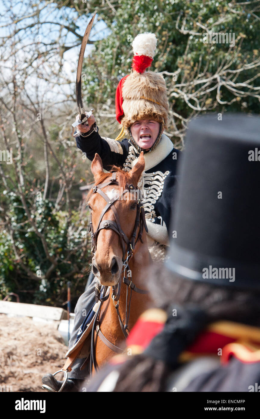 Sergeant of 7th Hussars charging soldier of horse artillery in a recreation of the battle of Waterloo 18 June 1815 Stock Photo