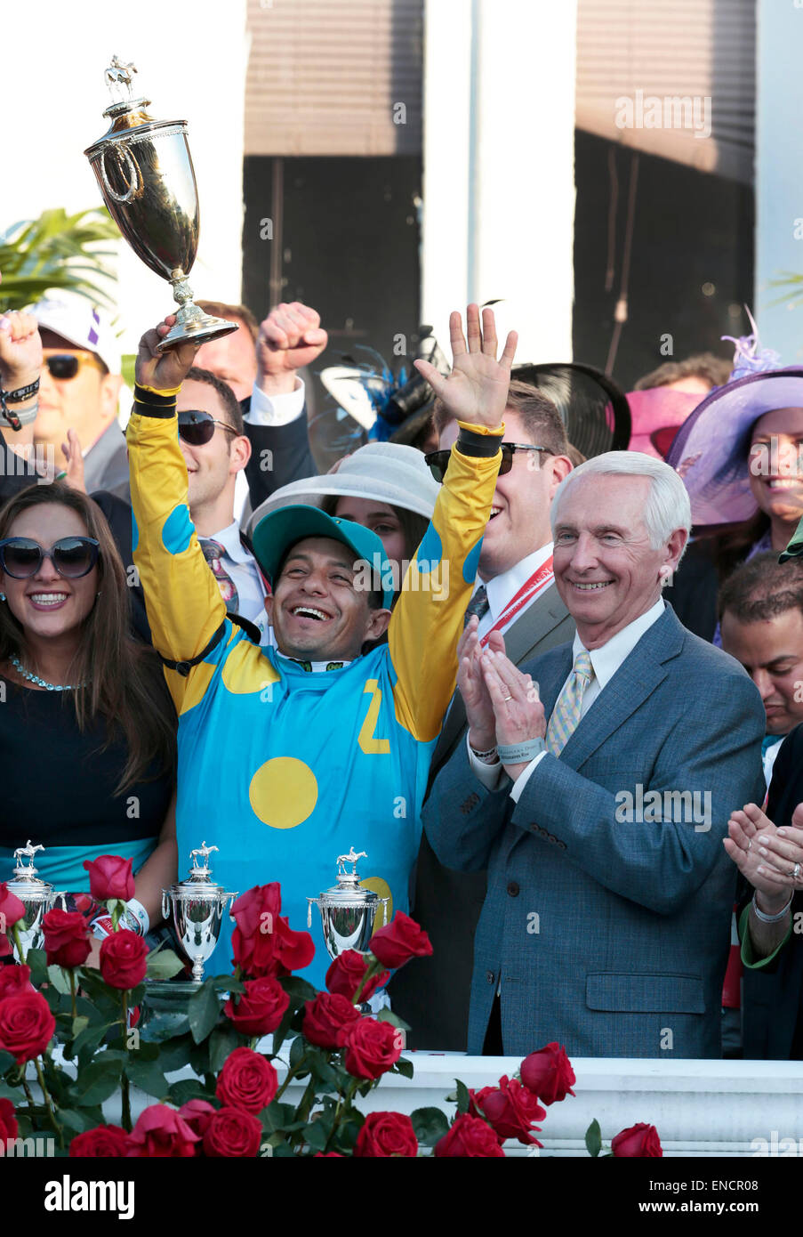 Louisville, KY, USA. 2nd May, 2015. Winning jockey Victor Espinoza, with Ky. Governor Steve Beshear on the right, held up the trophy in the winner's circle after winning the 141st running of the Kentucky Derby aboard American Pharaoh at Churchill Downs in Louisville, Ky., May 2, 2014. The race was won by American Pharoah with Victor Espinoza up. Photo by Charles Bertram | Staff Credit:  Lexington Herald-Leader/ZUMA Wire/Alamy Live News Stock Photo