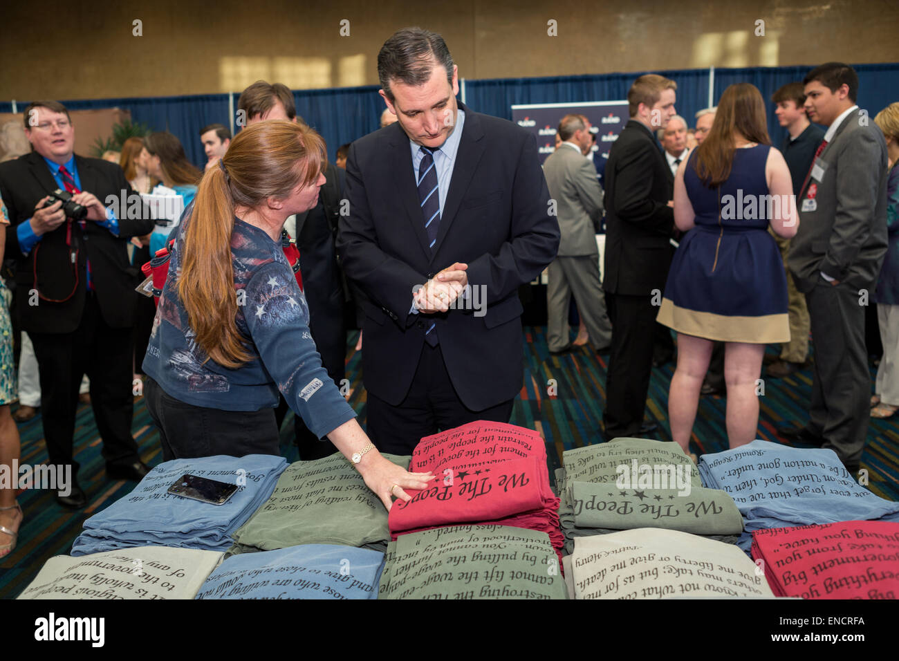US Senator and GOP Presidential hopeful Ted Cruz views conservative slogans printed on shirts at the 48th Annual Silver Elephant Dinner on May 1, 2015 in Columbia, South Carolina. The event honored Republican National Committee Chairman Reince Priebus and was attended by several presidential candidates. Stock Photo