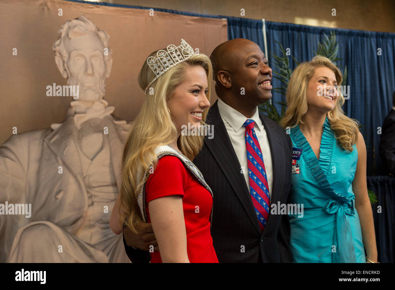 US Senator Tim Scott poses with two beauty Queens at the 48th Annual Silver Elephant Dinner on May 1, 2015 in Columbia, South Carolina. The event honored Republican National Committee Chairman Reince Priebus and was attended by several presidential candidates. Stock Photo