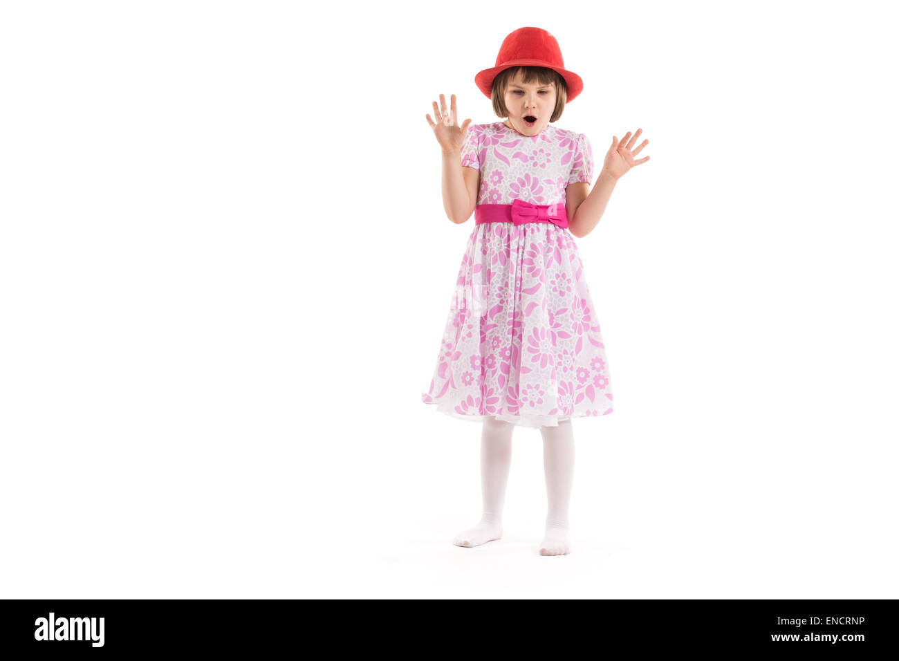 Surprised little girl on a white background Stock Photo - Alamy