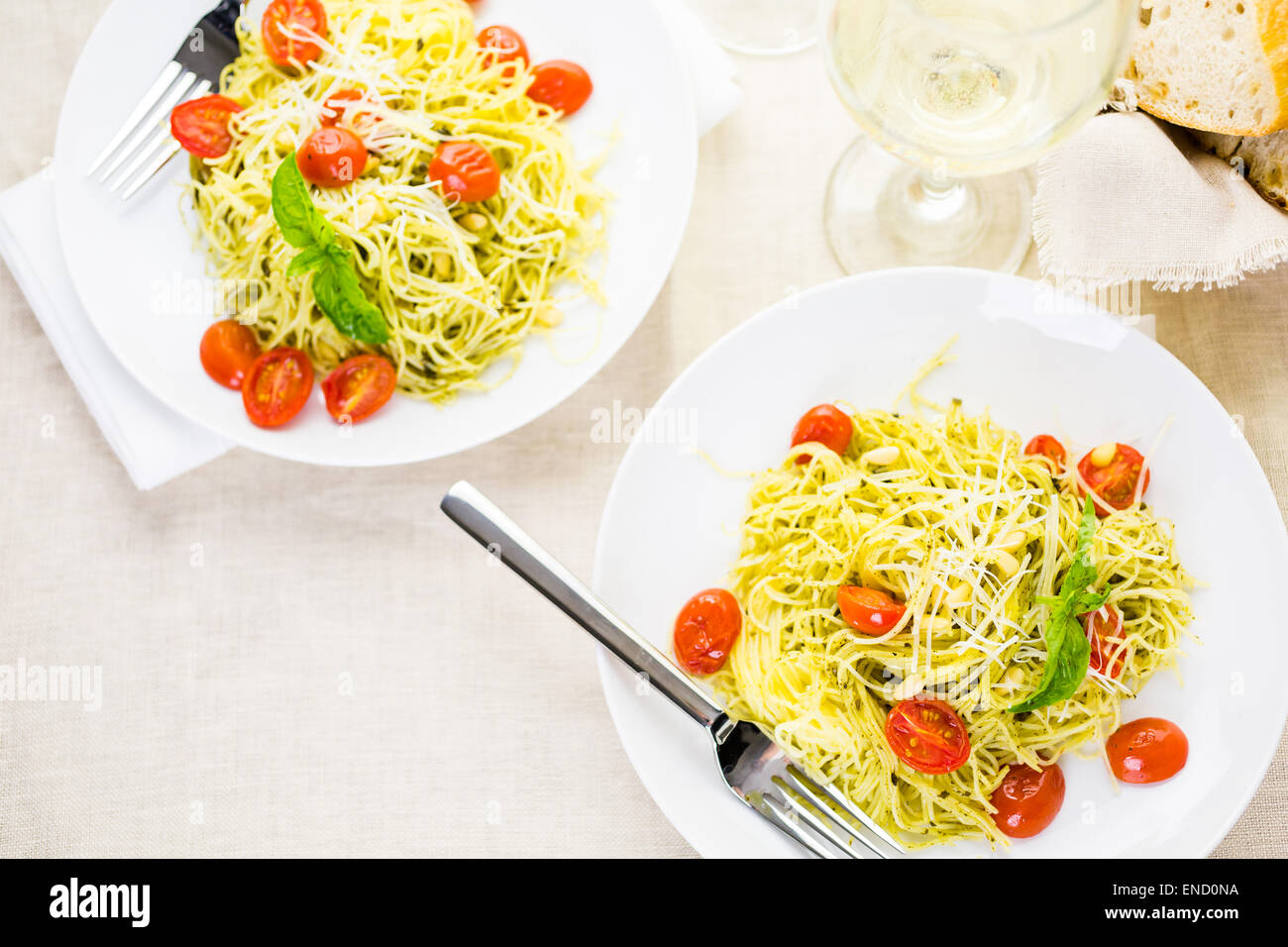 https://c8.alamy.com/comp/END0NA/homemade-angel-hair-pasta-with-pesto-sauce-and-roasted-cherry-tomatoes-END0NA.jpg